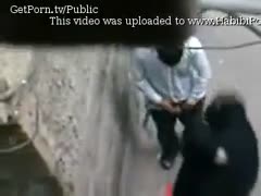 A webcam shows a sultry Arab cheating wife giving head while wearing a dark hijab.